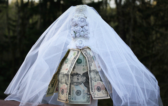 wedding dress covering money denoting good investment